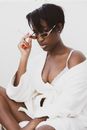 Woman in White Tank Top Wearing Black Sunglasses