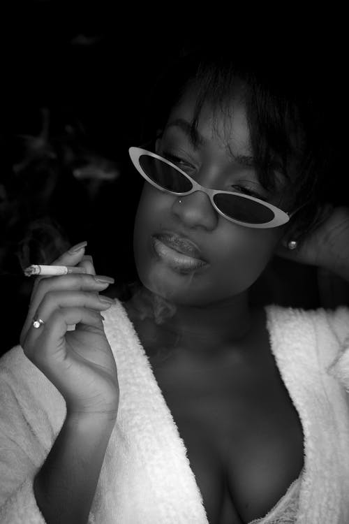 Grayscale Photo of Girl Wearing Sunglasses