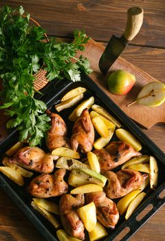 Delicious roasted chicken legs served with golden potatoes and fresh parsley.