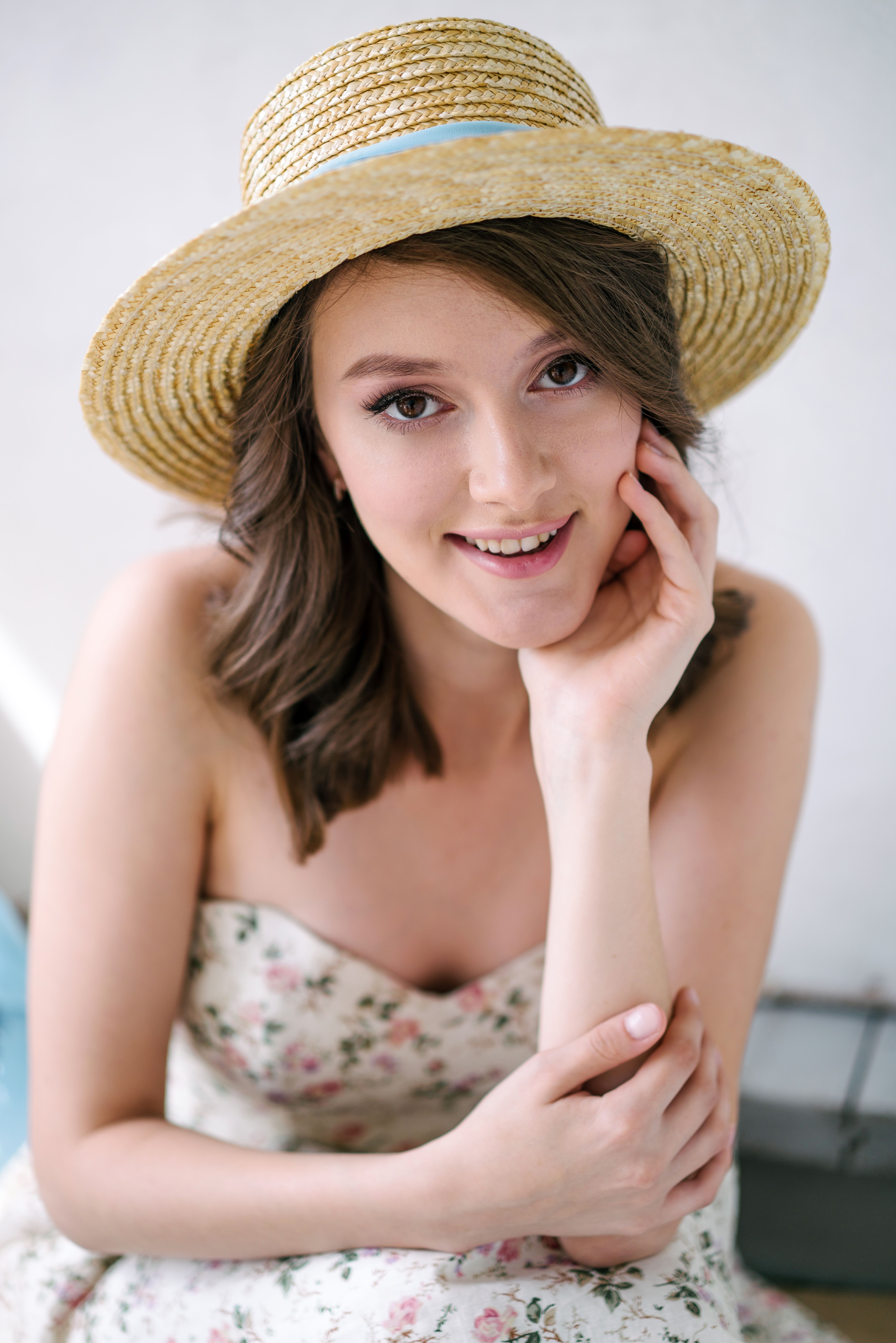 Woman in a Floral Dress and Straw Hat · Free Stock Photo