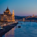 Brown Concrete Building Near the River