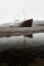 Brown and White Ship on Body of Water