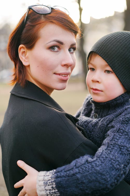 Mother Carrying Her Son 