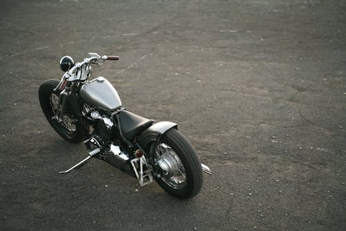 Black and Silver Motorcycle on Asphalt Road