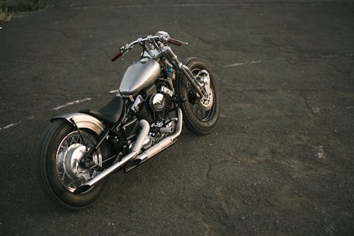 Free Black and Silver Cruiser Motorcycle on Asphalt Road Stock Photo
