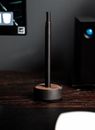 E cigarette in base charger placed on table