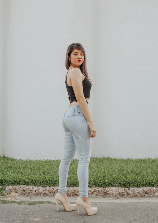 Vertical Side View Photo Of Young Beautiful Slim Girl Wearing