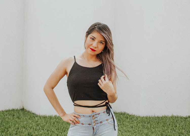 Young Lady With Bare Belly Standing On Street