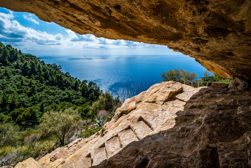 Brown Rock Formation Near Blue Sea