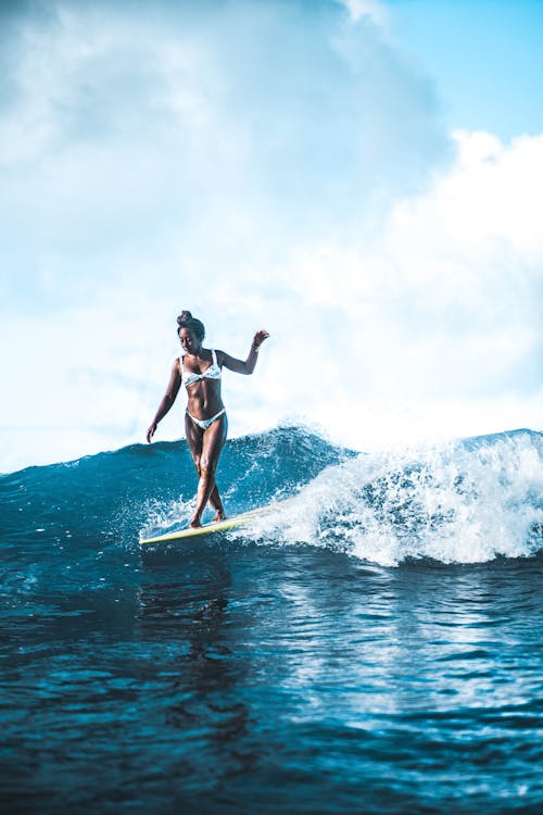 Woman Surfing on Sea Waves