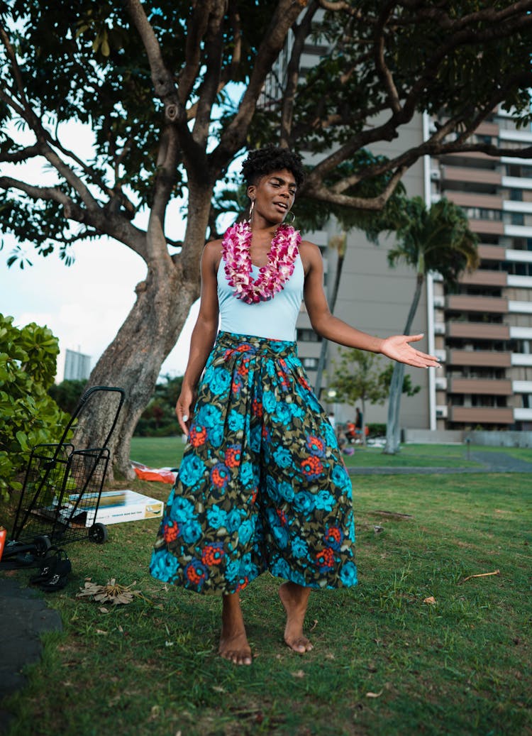 Woman In Traditional Clothes And Hawaii Wreath