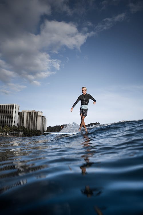 Man Riding On a Surfboard 