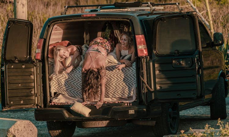 Women Lying Inside A Van