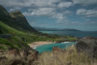 View of Mountains at Beautiful Seashore and Meandering Road on Cliff