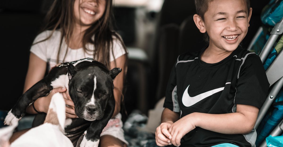 Happy family with their puppy