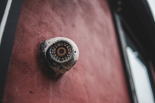 Free Old security camera on shabby building wall Stock Photo