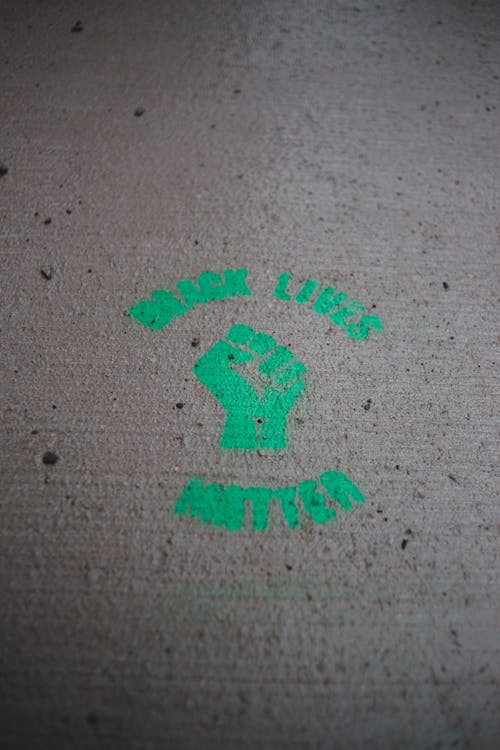 Free Green logo of Black Lives Matter movement on road Stock Photo