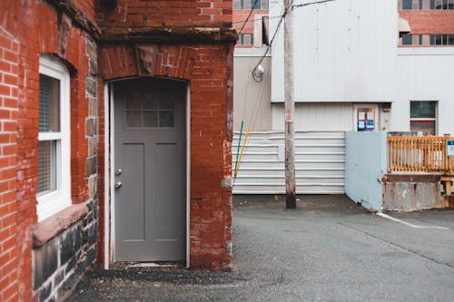 Door of aged brick building near road