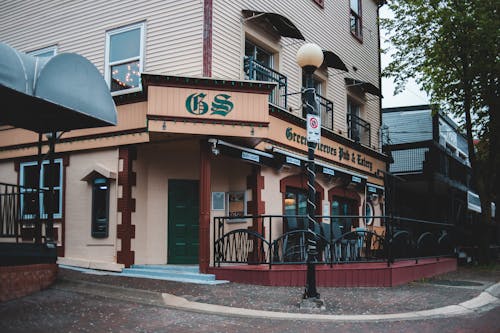 Modern pub facade near pavement in town