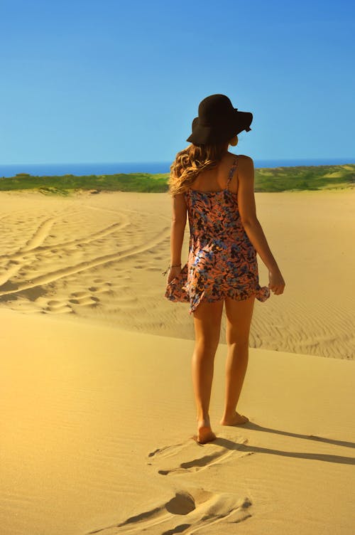 Woman Walking on Sand