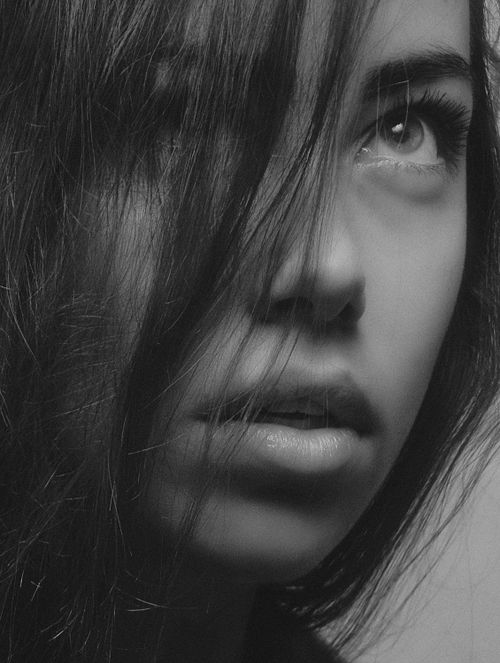 Free Stunning grayscale portrait capturing a young woman's contemplative gaze in Kyiv, Ukraine. Stock Photo