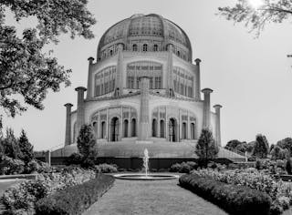 Facade of domed old Bahai temple on sunny day