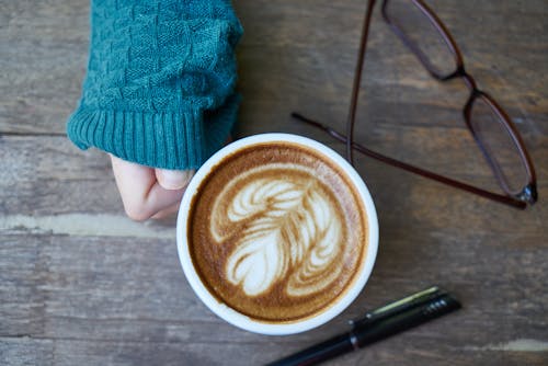 Woman Having Cup of Latte
