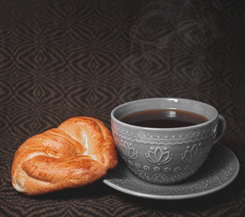 Croissant Bread Beside Black Coffee