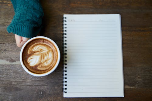 Black Rules Note Beside White Coffee Cup - Plan your day with a coffee in the morning is a great way to start the day