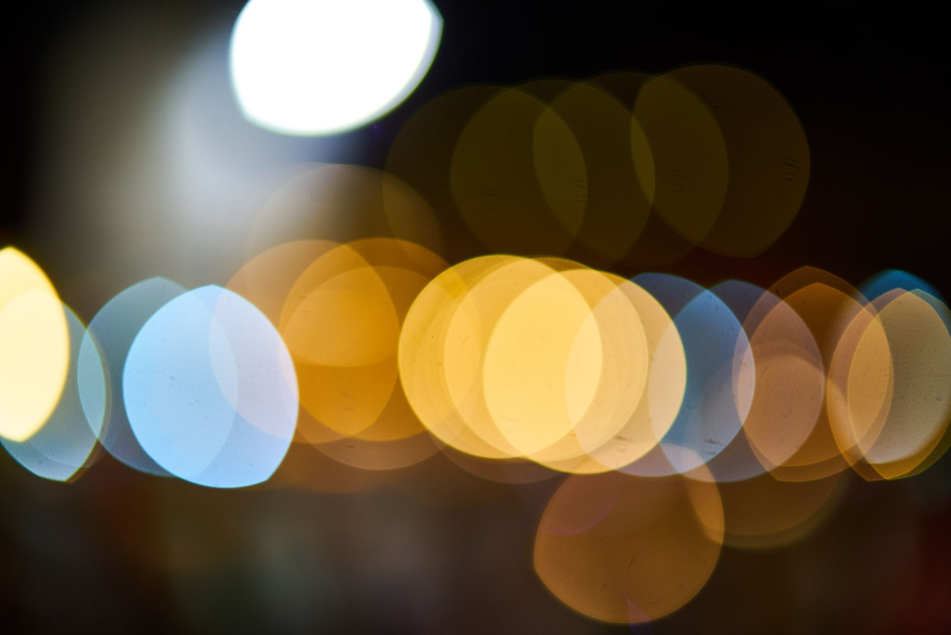 Vibrant circular bokeh effect with colorful lights in a blurred background.