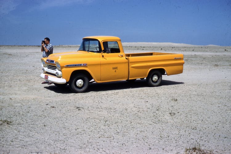 Yellow Chevrolet Single Cab Pickup Truck Parked On Road