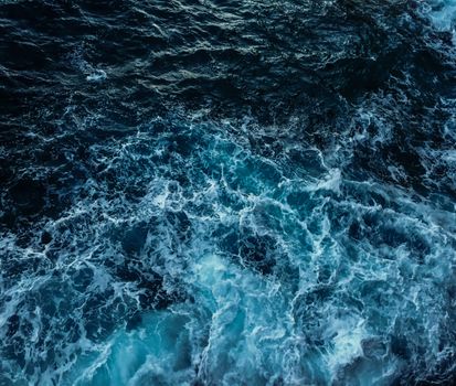 Captivating aerial shot of swirling ocean waves in Monaco, showcasing nature's power and beauty.