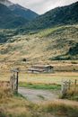 Brown Wooden House on Green Grass Field