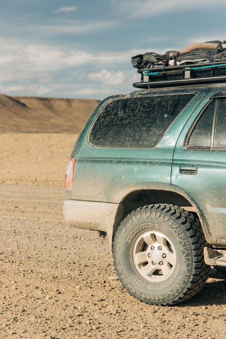 Dusty Car On An Off-road Trip 