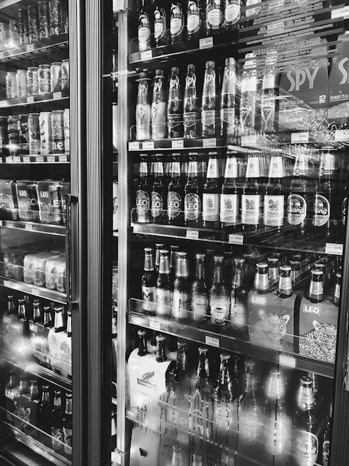 Beer bottles on shelves in store
