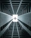 Grayscale Photo of a Man in the Middle of a Tunnel