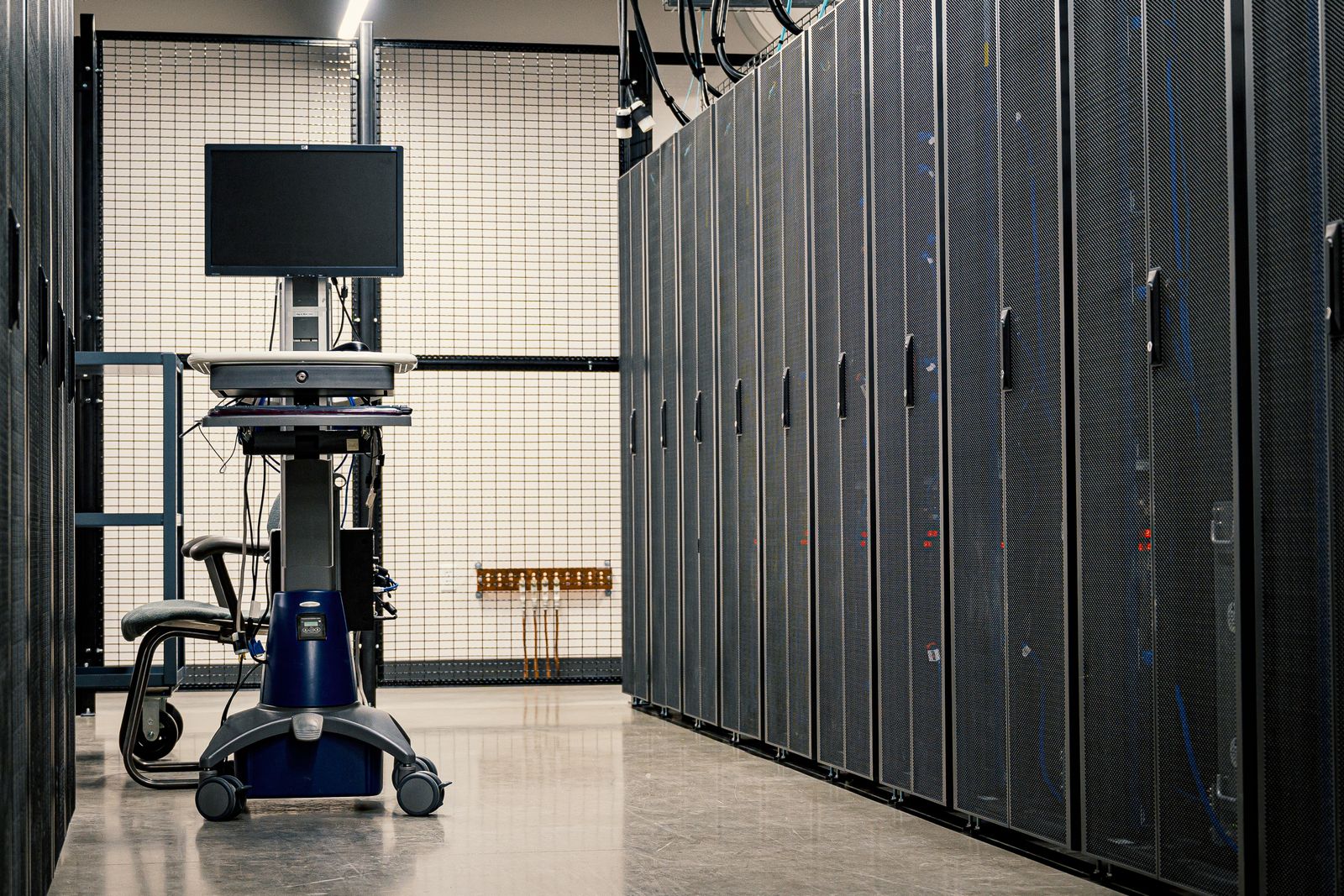 liquid cooling vs air cooling server data centers: data center aisle where airflow and rack density constraints are planned.