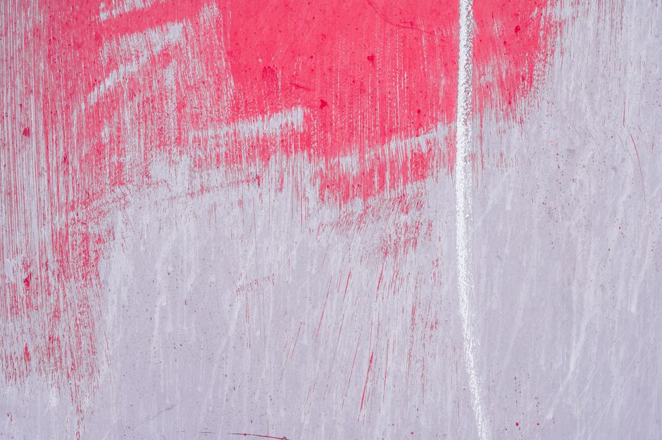 Long narrow line on surface of old weathered shabby vibrant pink violet wall in daylight