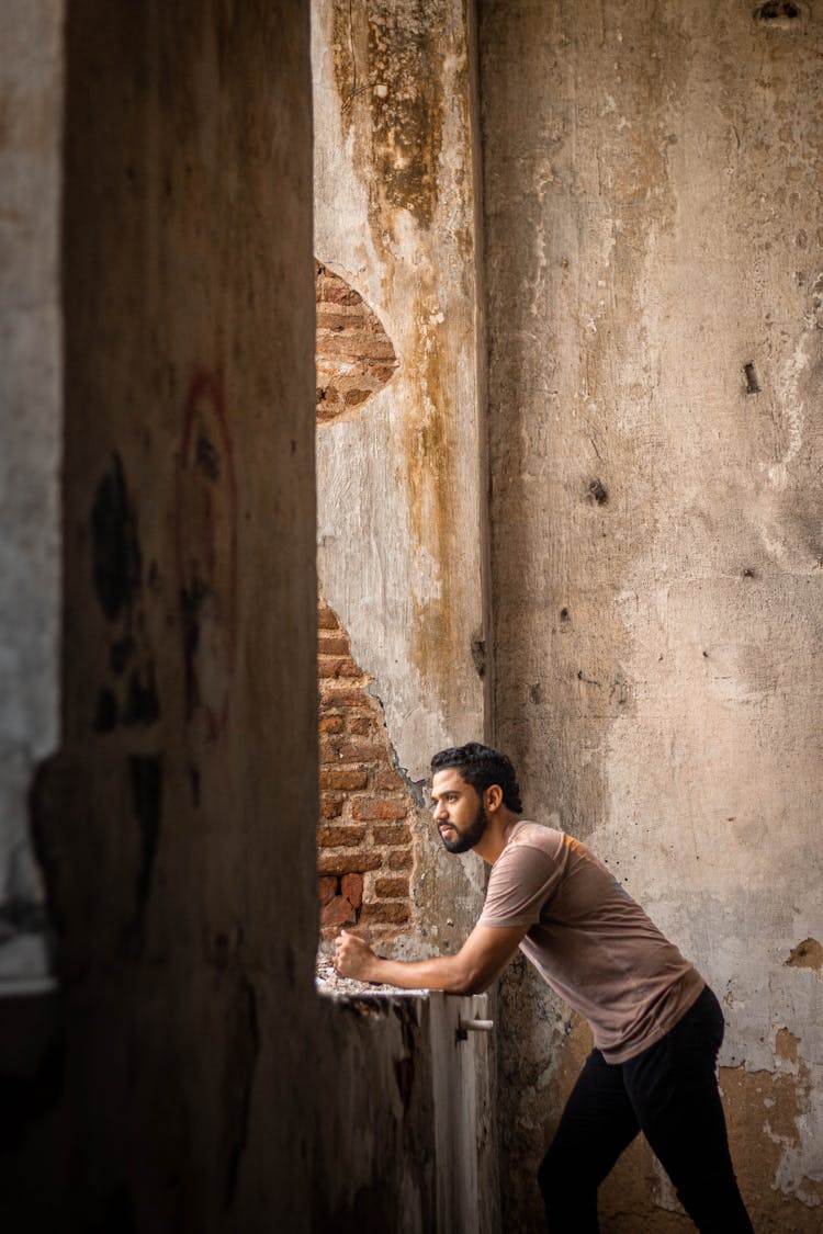 Pensive Man In Shabby Room