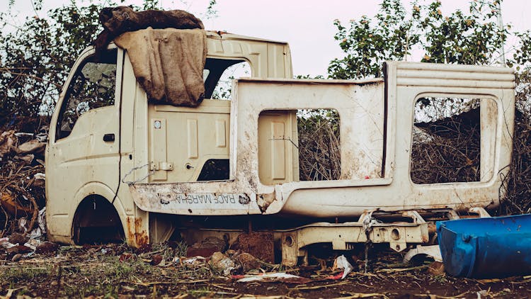 Broken Abandoned Car On Derelict Site