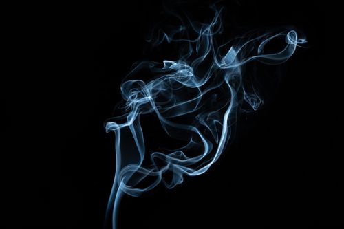 Free Abstract backdrop of thin blue wavy vapor fluid with shiny surface on black background Stock Photo