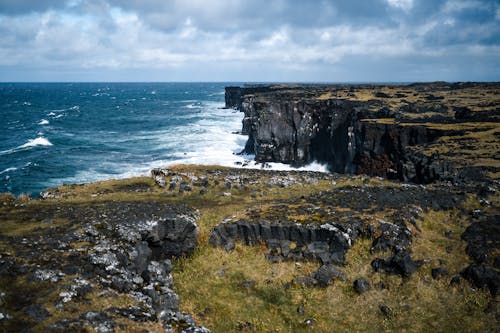 Rugged Mountain Cliffs Along the Coastline of Snæfellsjökull National Park in Iceland