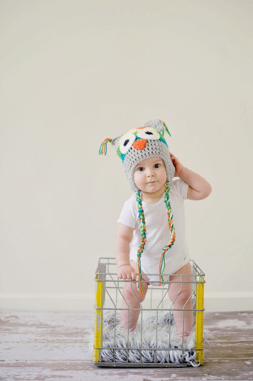 Free Toddler Standing on Basket Stock Photo