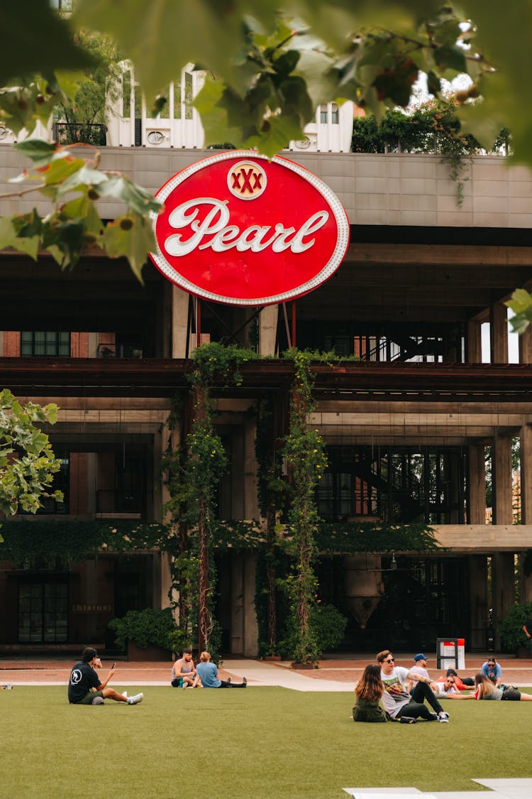 A Signage Hanging From A Building