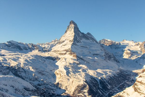 The snow-covered Matterhorn under a clear blue sky