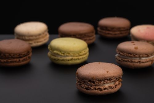 Free High angle soft focus of chocolate macaroon cookie made of meringue and minced almonds Stock Photo