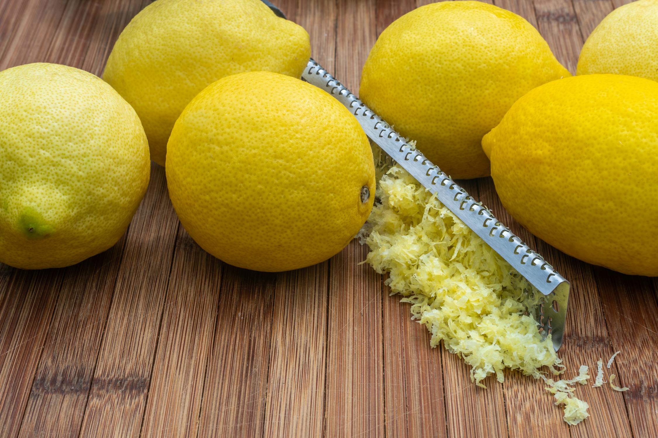 Ripe lemons with zest and grater on table · Free Stock Photo