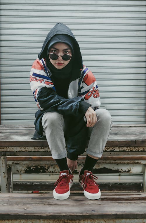 Free A Woman Wearing a Hoodie Jacket with Sunglasses Stock Photo