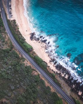 Aerial view of a road along a picturesque coastline in Honolulu, Hawaii.