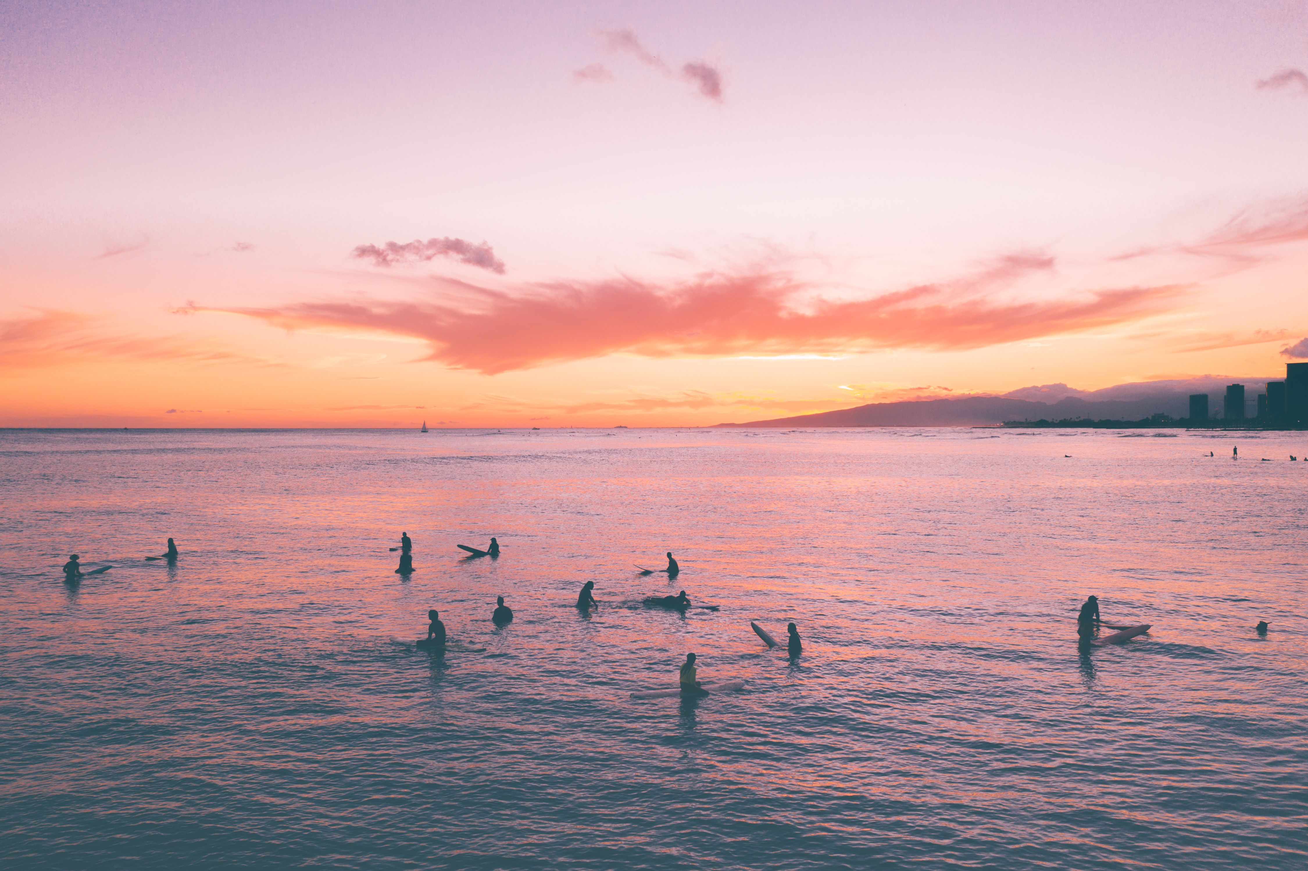 Silhouette of People on Sea during Sunset · Free Stock Photo